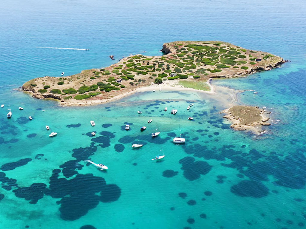 Day cruise from Alimos to Russian Bay, Poros town and Katramonisi with swimming, sightseeing, and local charm